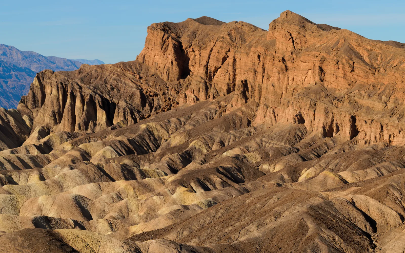 Zabriskie Point in Death Valley National Park showing dramatic desert landscape and geological formations characteristic of California's natural heritage